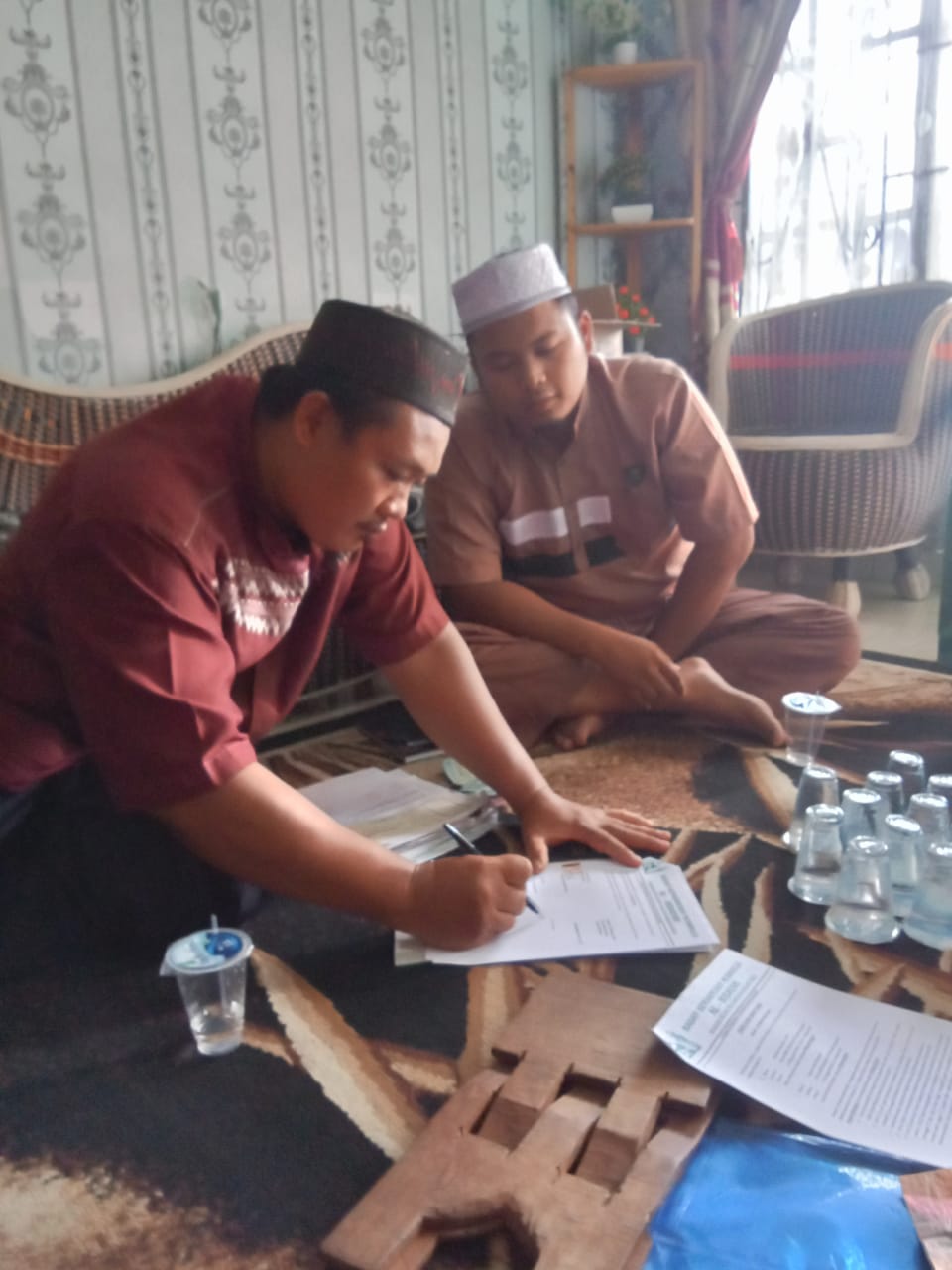 Serah terima laporan keuangan BKM musholla Al hidayah